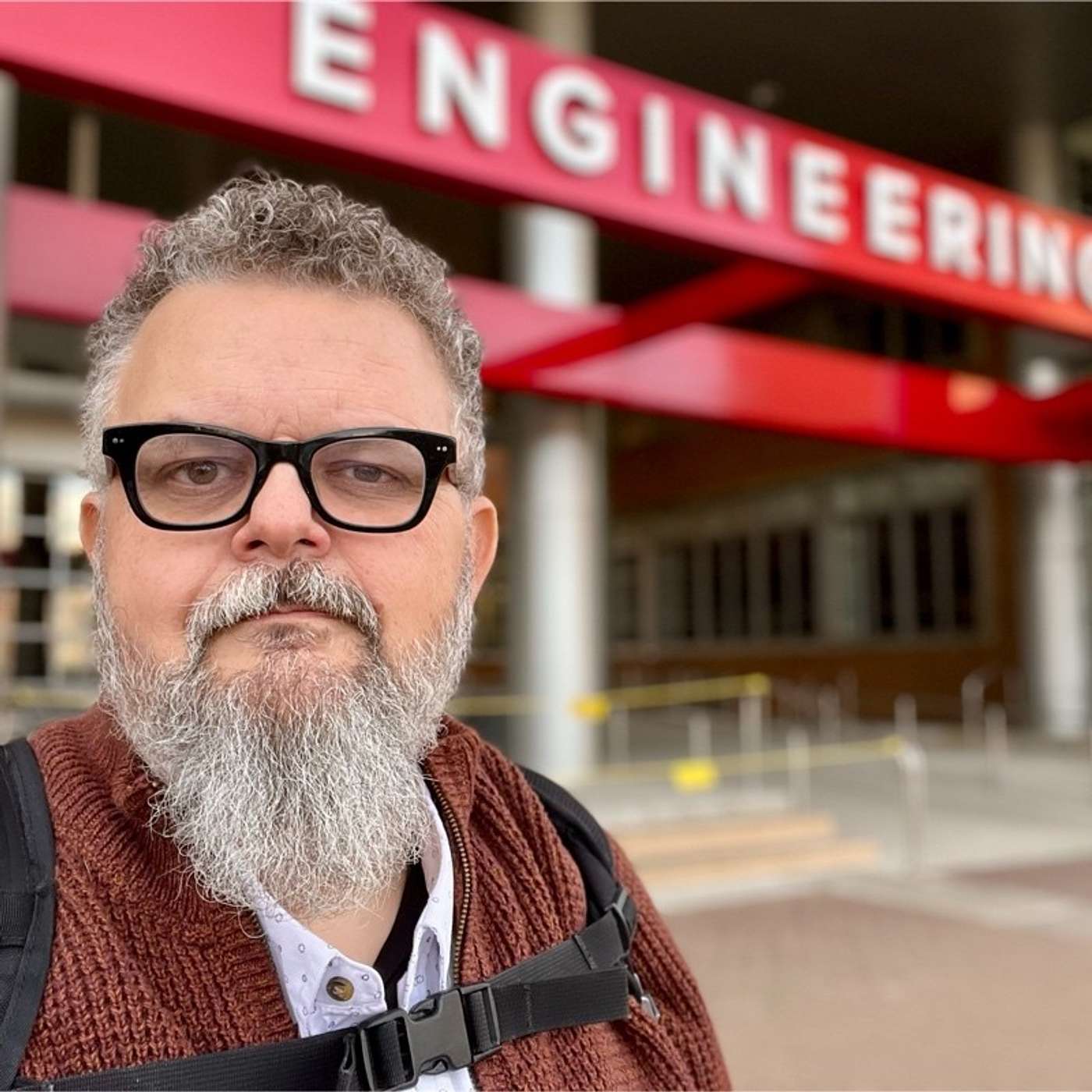 A selfie of Jim Remsik in front of an engineering building.