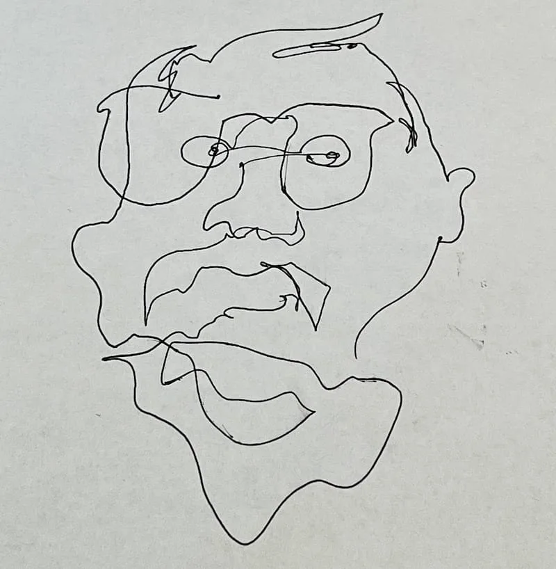 A sheet of white paper with one continuous pen stroke that forms the rough visage of Yossef.