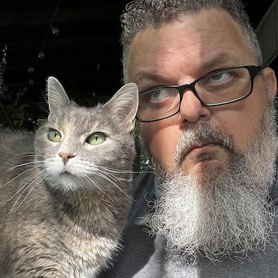 Sookie the kitty and Jim pondering about the next treat that will be handed to them