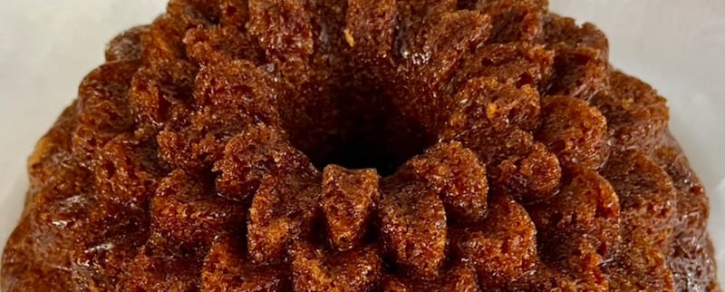 A carrot cake that has been baked in a Bundt pan.
